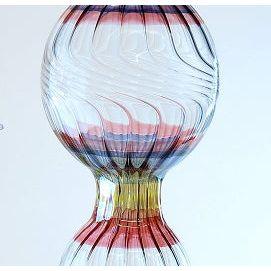 Glass Hummingbird Feeder showcasing vibrant stripes 