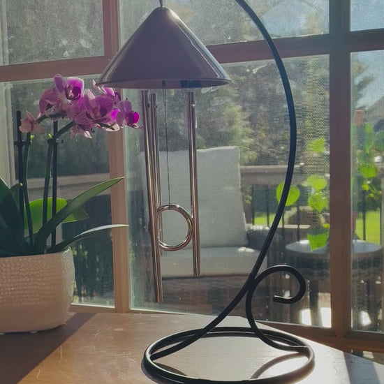 Video of the Sprite indoor solar wind chime gently chiming in sunlight